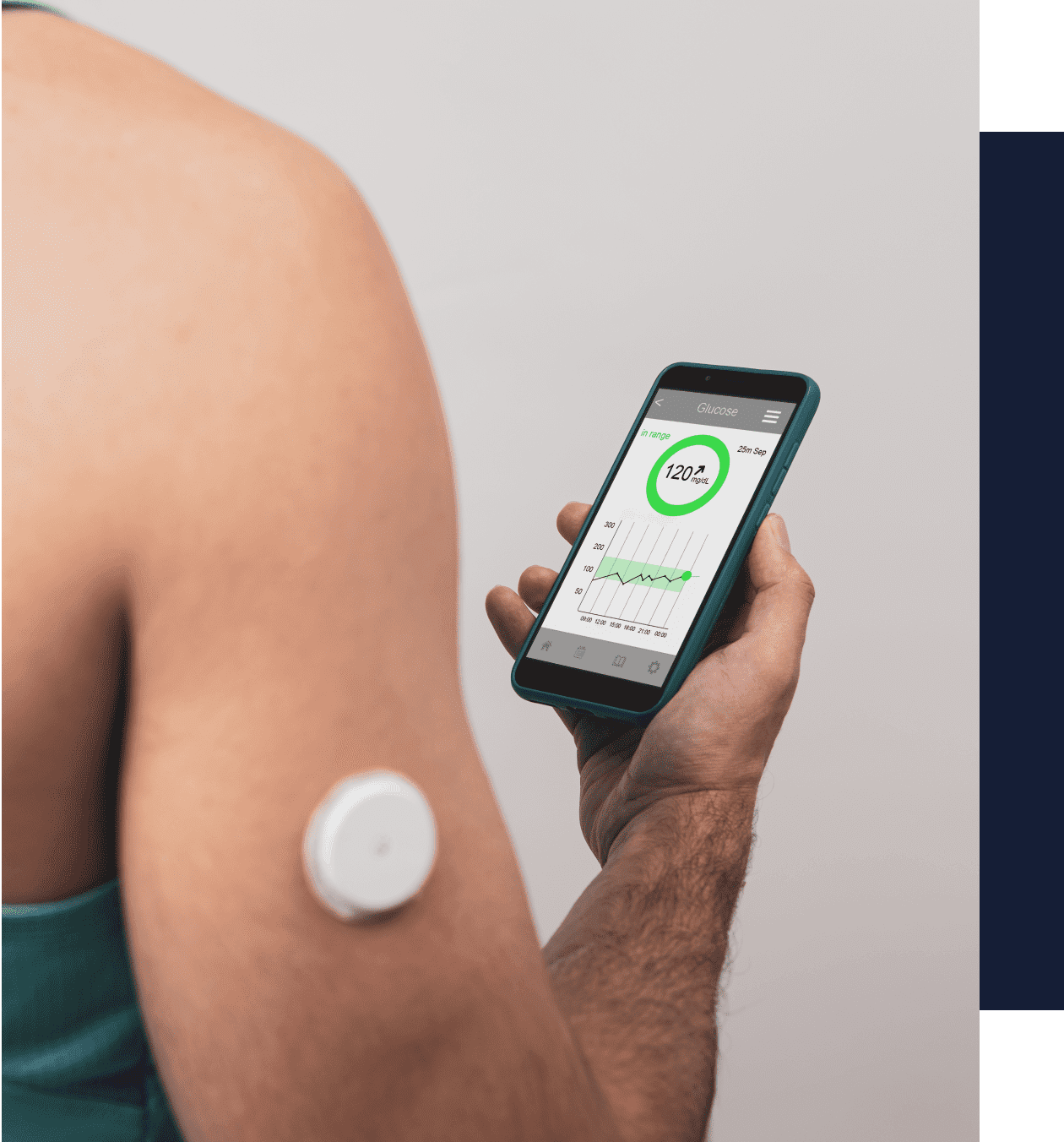 A person is holding an electronic device in their arm.